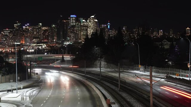 A time lapse of vehicles and their light trails as they leave downtown Calgary Alberta Canada on Bow Trail.