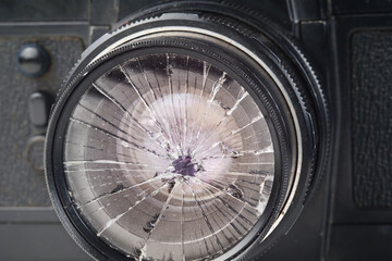broken lens on the old vintage film camera, closeup