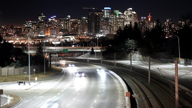 A time lapse of vehicles and their light trails as they leave downtown Calgary Alberta Canada on Bow Trail.