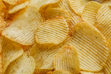 Potato chips or crisps .Potato chips texture background flat overhead view.concept of fast food and snacks. Food background.