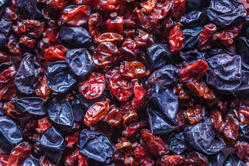 dried barberry berries. A mixture of different spices close up. Textures of colorful spices and...