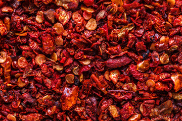 Сrushed dry red paprika. A mixture of different spices close up. Textures of colorful spices and condiments.Colorful Herbal and Spices Oriental.Various Indian spices