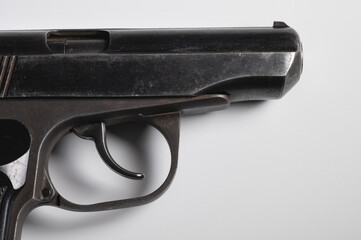 Old Soviet pistol. Close-up on white background