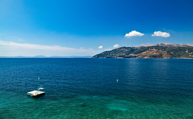 Obraz premium View from Albanian coast to Corfu island, Greece. Beautiful Ionian sea landscape.