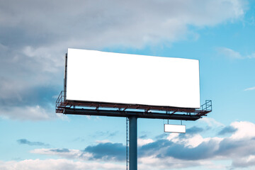 Blank billboard with clouds and blue sky