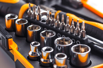 Interchangeable screwdriver set with different types of metal steel heads and bits. Isolated on white background.set of working tools