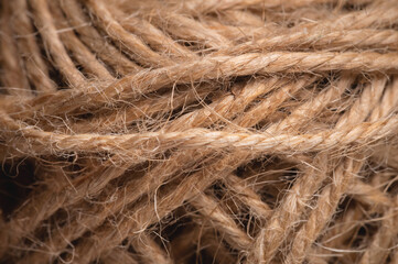 Natural rope twine textured background close up plan. Fibers in a mess rustic style