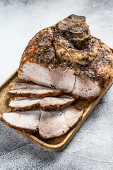 Roasted sliced pork ham.  Shank meat.  Gray background. Top view