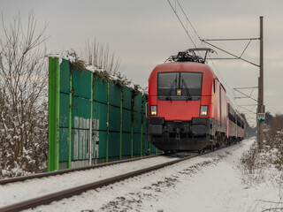 Fototapeta na wymiar Train from Austria to Czech republic near Ceske Budejovice city in snowy day