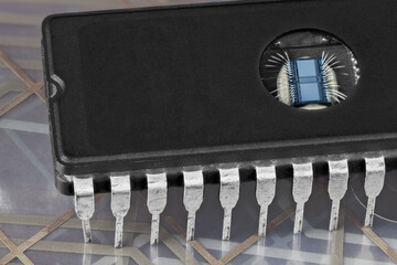 Computer erasable programmable read-only memory chip on flex PCB membrane detail. Digital EPROM...