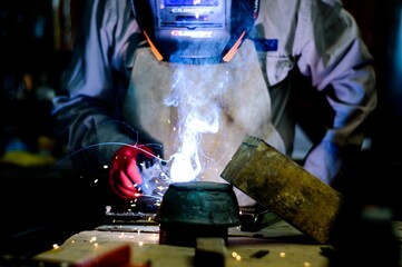 Man welding in a metallurgical workshop
