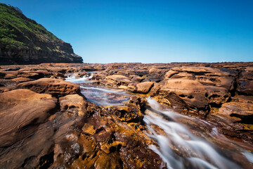 Water on the rocks at Avoca Beach on NSW Central Coast