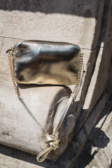 Festive evening golden clutch. Luxury accessories and party concept.