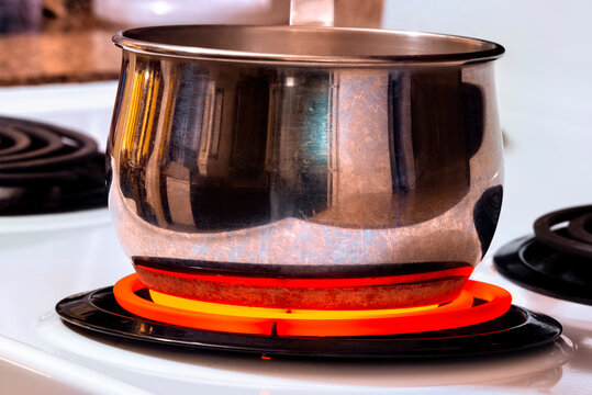 Cooking Pot On Top Of Hot Stove Top Burner