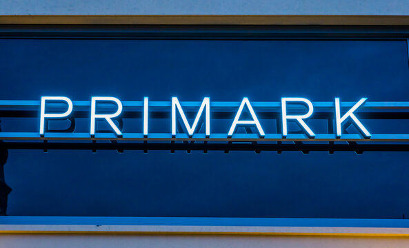 lighted primark neon sign on a shopping window, exterior of the primark store in Tilburg, The Netherlands,10 December, 2019