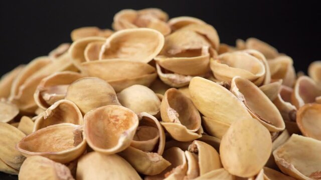 Empty pistachio shell without core rotating