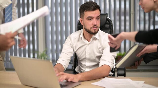 Rush of work from peers and managers descends on the young, tired manager of the firm