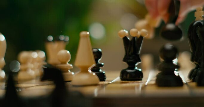 Macro View of Chess Game with Gambit Opening. White Pieces Win with Checkmate. Sport and Hobby at Lockdown. 4K Cinematic Macro Pan Shot in Slow Motion with Wooden Chess Pieces
