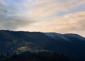 landscape with mountains and clouds at sunset