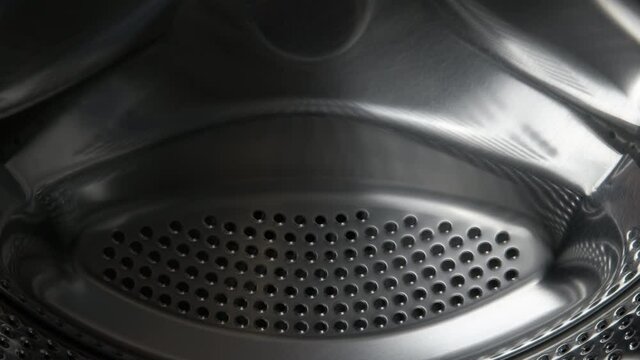 Washing machiner drum. Washing machine drum empty.