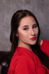 portrait of attractive brunette woman in red blouse. st valentines