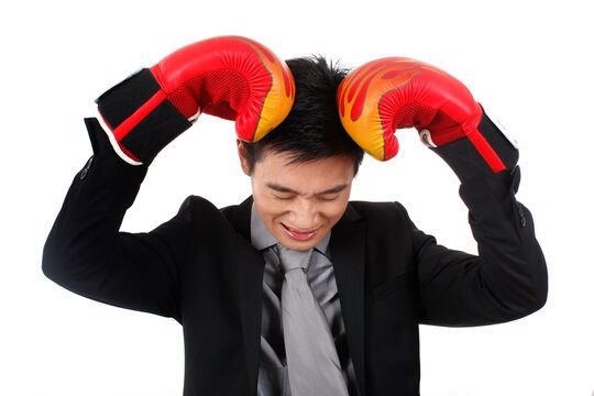 Young business man with red boxing gloves