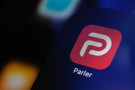 Parler app logo seen on the screen of iPad. Parler is a social media platform removed from Apple App Store. Stafford, United Kingdom - January 11 2021: 