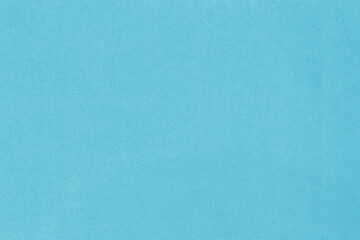 Clean blue retro paper background. Vintage cardboard texture. Grunge paper for drawing. Simple blank fabric pattern.