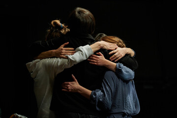 Fototapeta na wymiar three people hug and hug each other, confirming the great friendship and bond between them