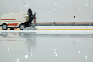 Special lorry or ice flattening machine moving along ice-rink at leisure center