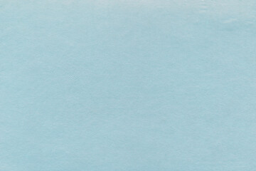 Clean blue retro paper background. Vintage cardboard texture. Grunge paper for drawing. Simple blank fabric pattern.