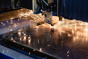 Process of industrial laser cutting of sheet metal.