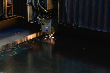 Process of industrial laser cutting of sheet metal.