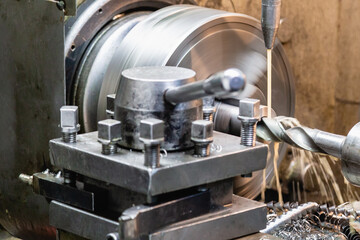 Obraz premium Machining on a lathe, internal boring of a part with a tool.