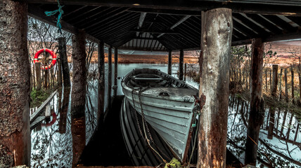 A boat in a boathouse at Lough Veagh in Glenveagh National Park, in the heart of the Derryveagh Mountains, northwest of County Donegal, Ireland.