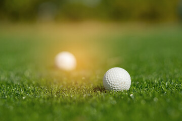 Golf balls on artificial grass with blur background
