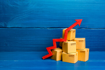 Cardboard boxes and red arrow up. Transformation of the economy and trade into online marketplaces,...