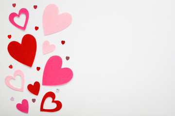 Felt hearts on white background. Valentine's day and love romantic concept with copy space for text.