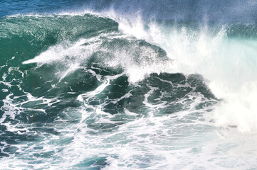 Fototapeta premium explosive surf across a white and green ocean.