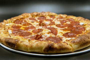 Stuffed crust pizza covered with pepperoni and melted cheese for a very hearty meal.