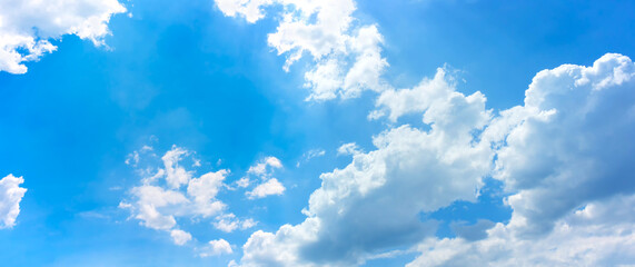Naklejka na ściany i meble sky and clouds background,bright day light in blue sky with white fluffy clouds