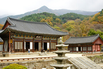 Fototapeta na wymiar Hwaeomsa (Hwaeom-sa) Buddhist temple in South Korea's Jirisan National Park on a cloudy day in autumn