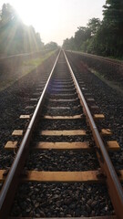 Railroads with yellow pads of concrete and pebbles around it