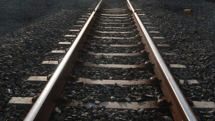 Railroad with concrete cushion and gravel around it