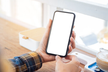 cell phone blank white screen mockup.woman hand holding texting using mobile on desk at office.background empty space for advertise.work people contact marketing business,technology