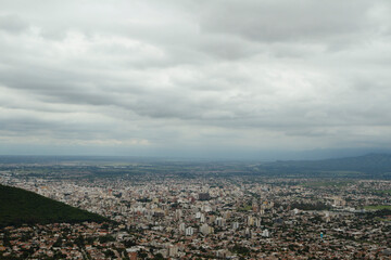 Obraz premium Urban texture and pattern. Aerial view of the city buildings under a cloudy sky. 