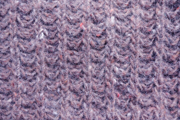Closeup of brown knitted pattern from winter sweater.