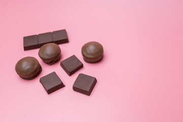 Fototapeta na wymiar Valentine dark chocolate on pink background, Valentines Day Theme