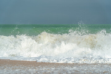 Fototapeta premium Big waves and surf on a sandy tropical beach