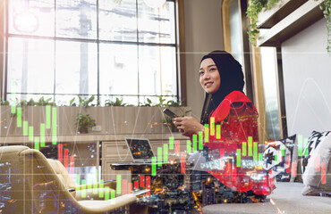 Business woman Islamic girl sitting with phone, laptop computer, Double exposure of financial and statistics graphs  .